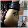 4003140300-boxing-gloves-adidas-hybrid-300-leather-black-gold-action2-800×800